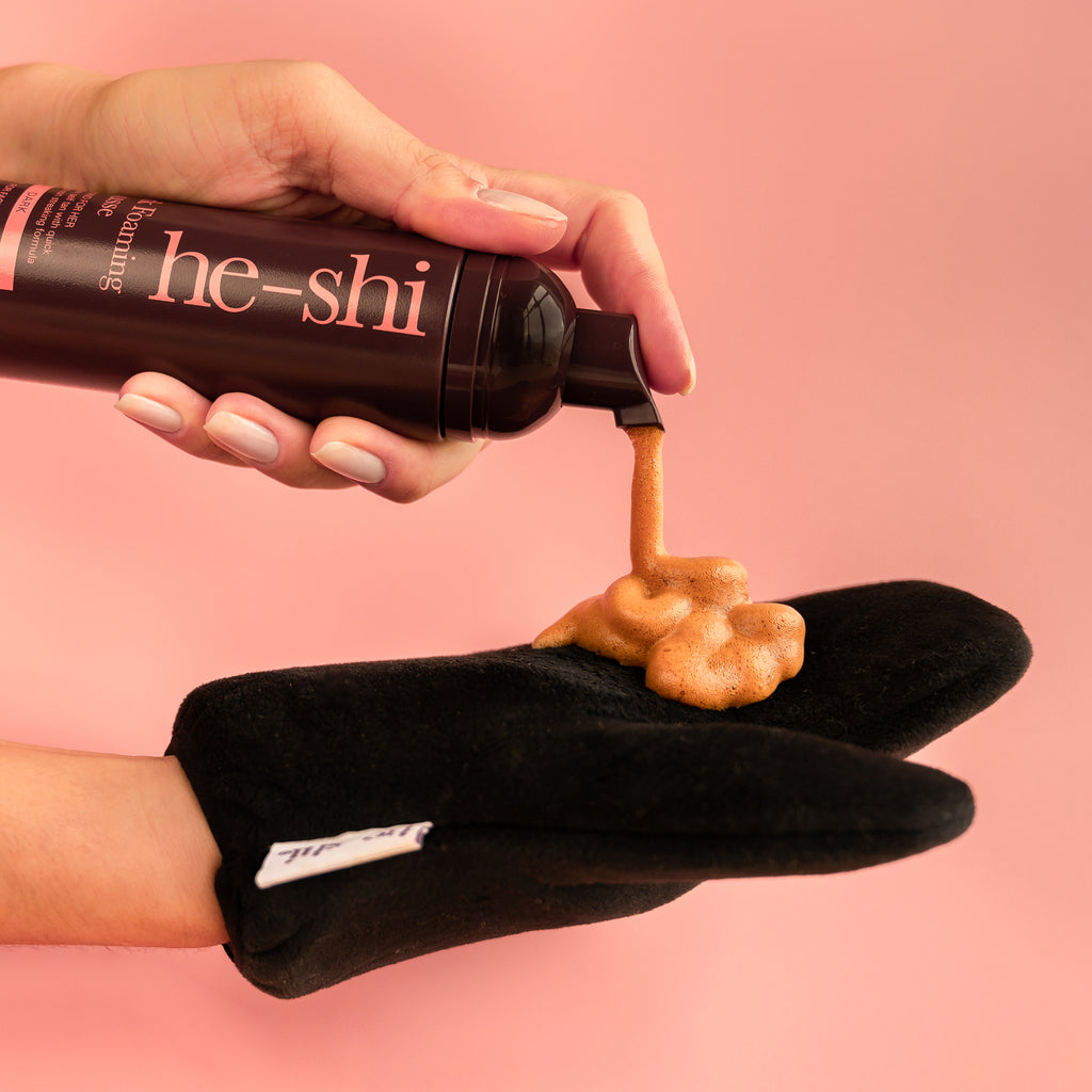 He-Shi Dark Foaming Mousse in a bottle, showcasing its rich, dark formula for self-tanning with a quick-dry feature.