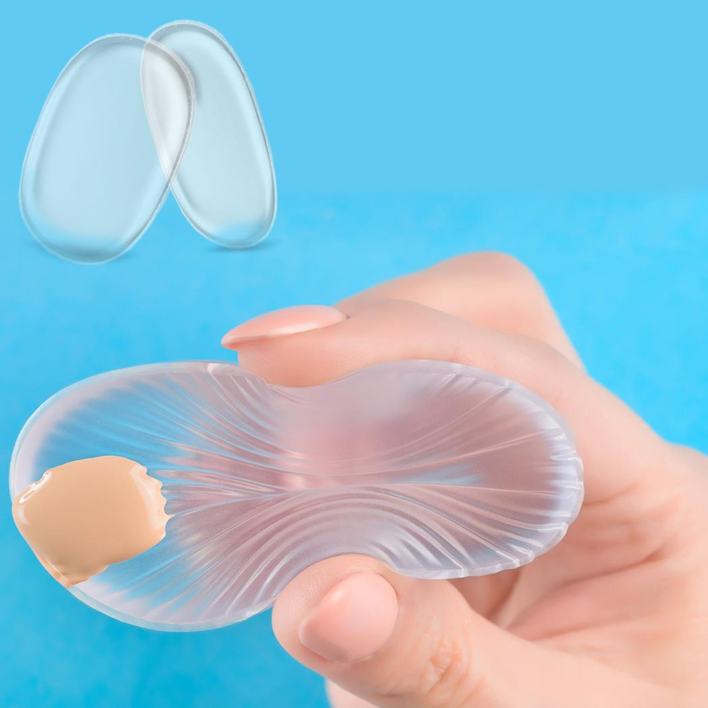 Clear silicone makeup sponge by GlowCare, showcasing its smooth surface and flexible design for effortless application.