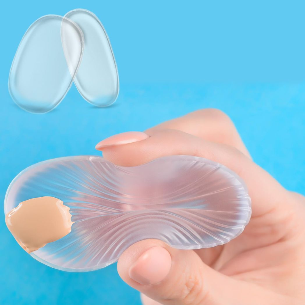 Clear silicone makeup sponge by GlowCare, showcasing its smooth surface and flexible design for effortless application.