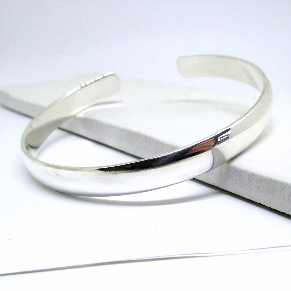 Chunky silver bangle by LuxeTime, 18cm diameter, featuring a sleek sterling silver plated design.