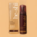 He-Shi Gold Foaming Mousse bottle with medium self-tan formula, showcasing easy application and quick-dry feature.