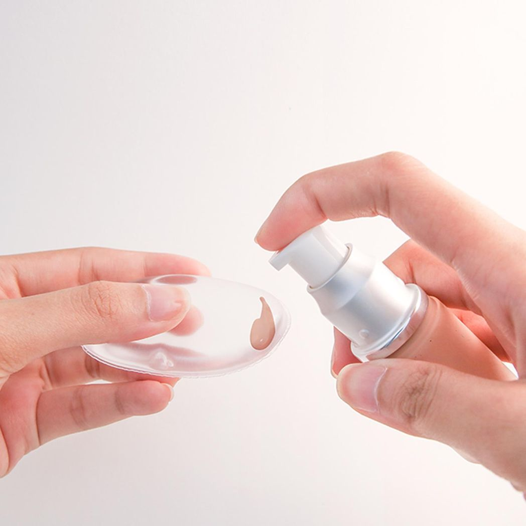 Clear silicone makeup sponge by GlowCare, designed for seamless application and blending of cosmetics.