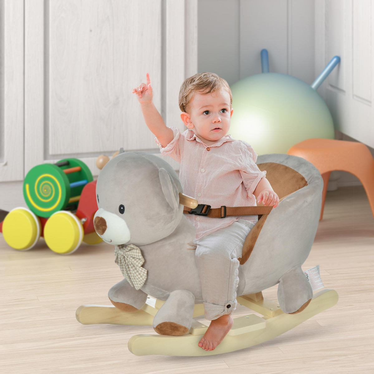 Kids rocking bear plush ride-on toy with sound button and seat belt, suitable for ages 18-36 months.