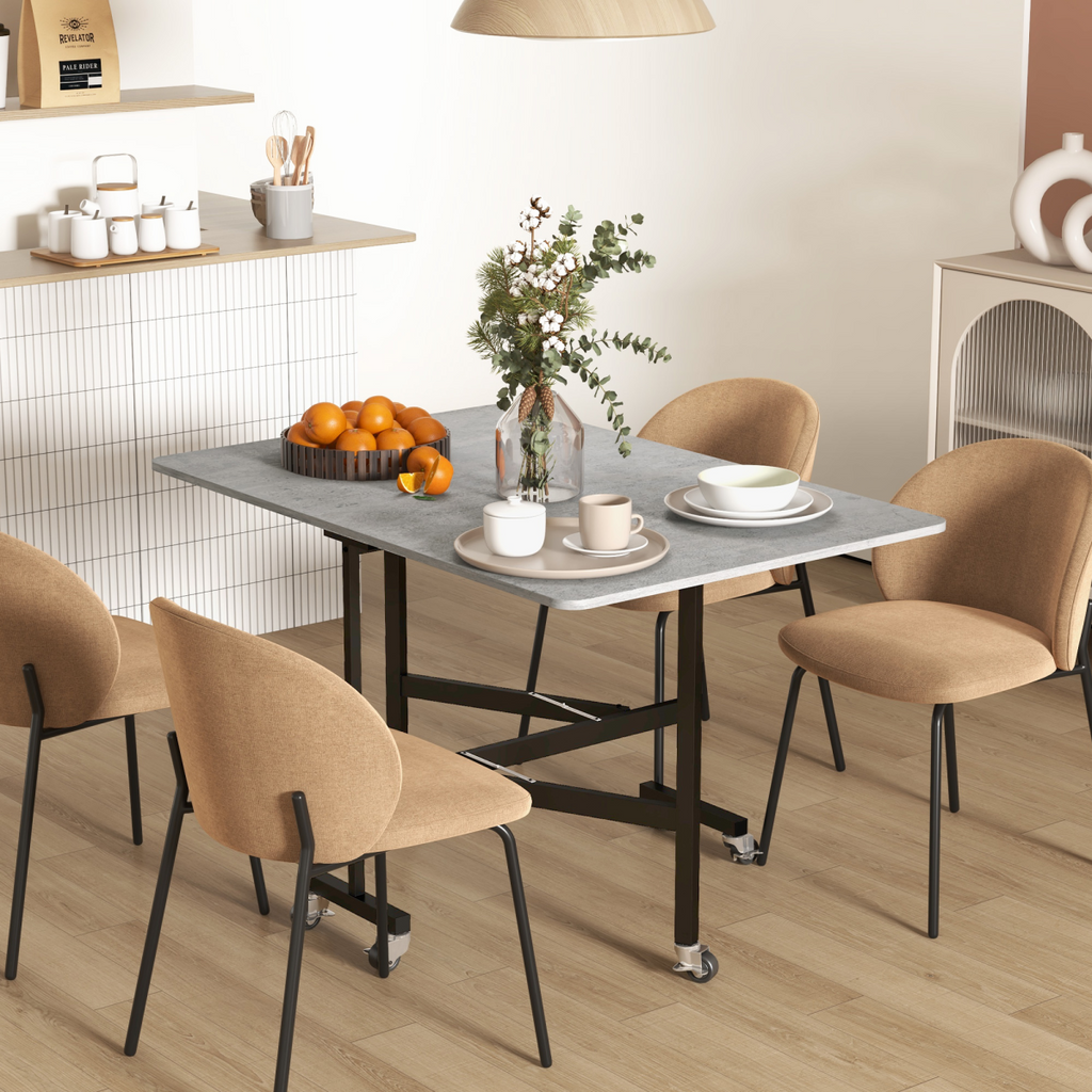 HOMCOM grey drop leaf table on wheels, ideal for small spaces, showcasing a folding design in a cozy dining setting.