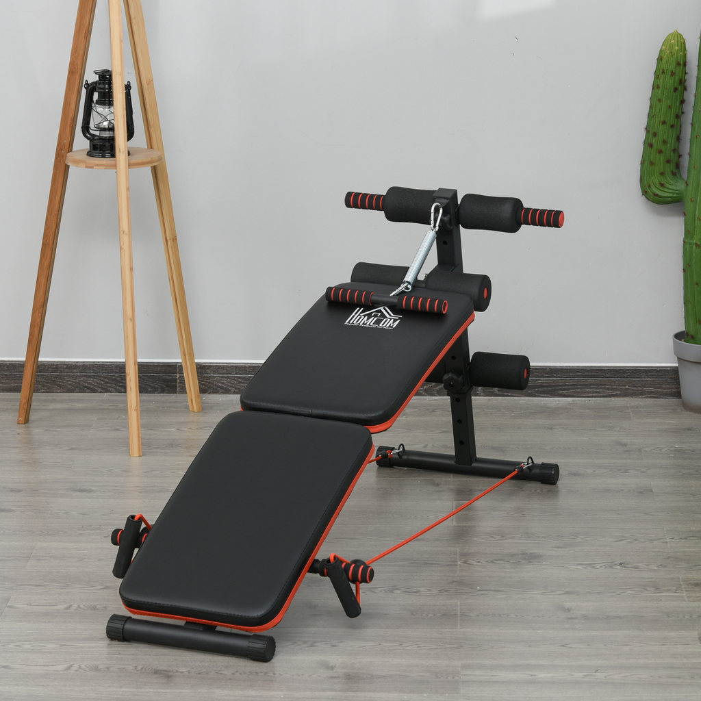 Foldable black sit up bench for core workouts, designed for home gym use, featuring a compact and durable design.