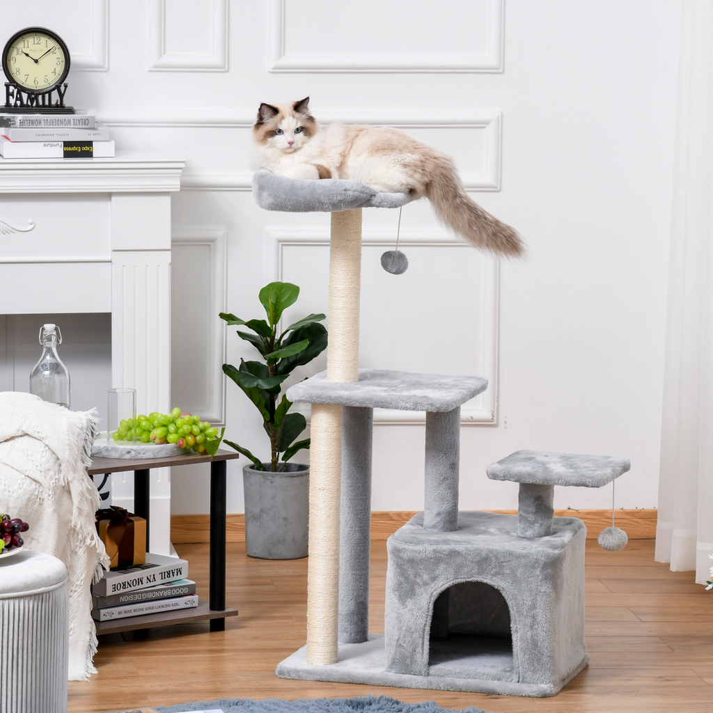 Pawhut cat tree tower with scratching posts, hanging ball, and condo, measuring 60 x 40 x 114cm, in a cozy setting.