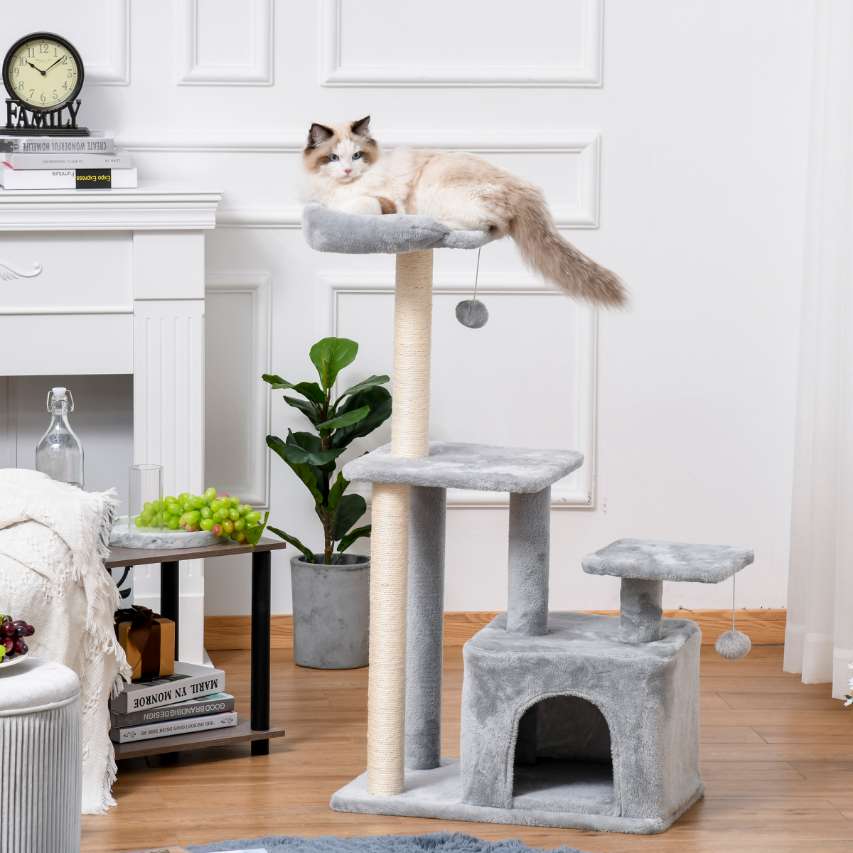 Pawhut cat tree tower with scratching posts, hanging ball, and condo, measuring 60 x 40 x 114cm, in a cozy setting.