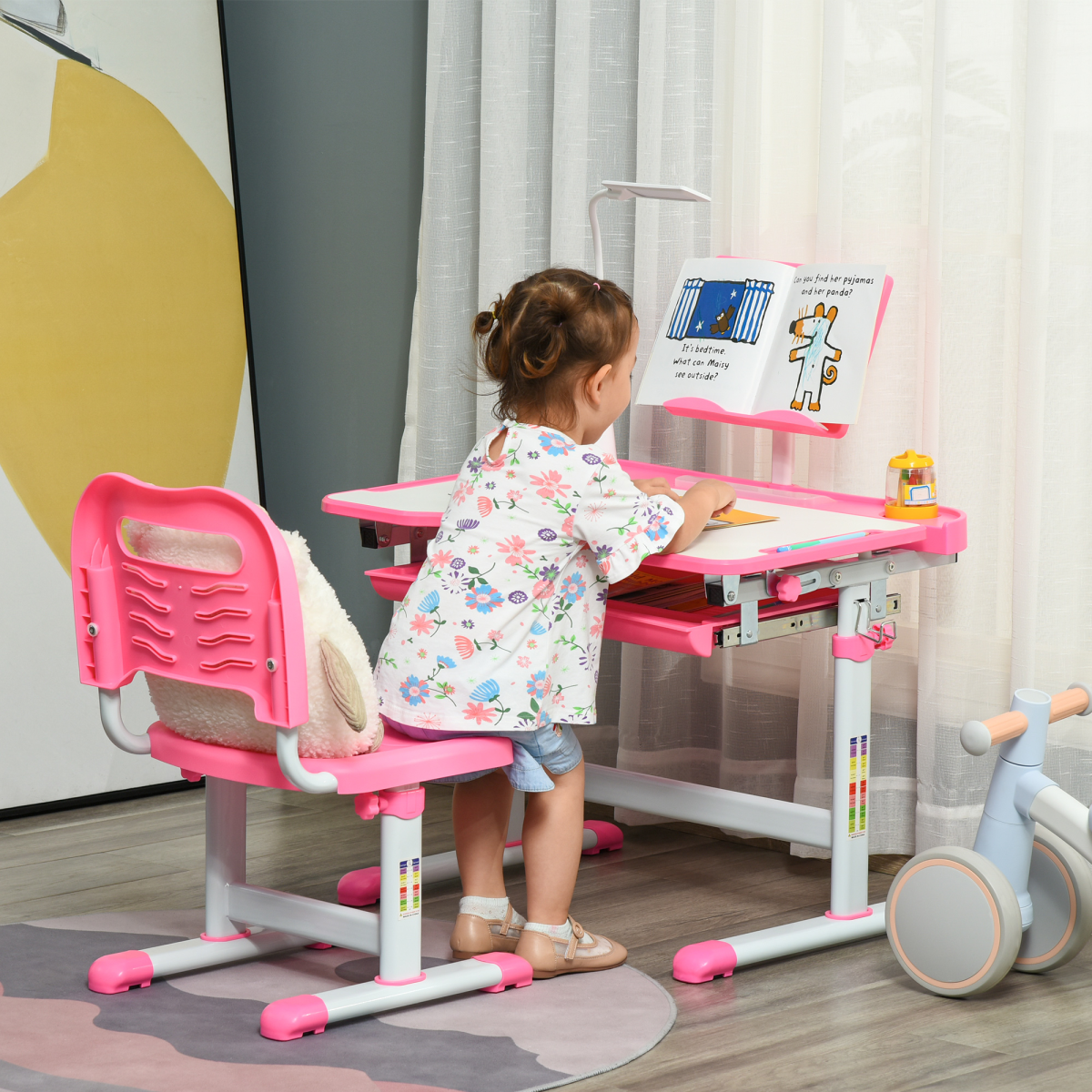 Kids study desk and chair set in pink with adjustable height and storage drawer by HOMCOM.