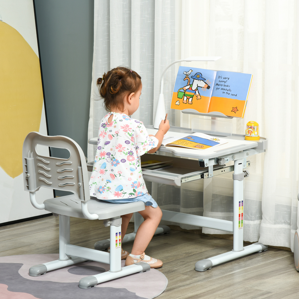 Kids study desk and chair set in grey with adjustable height and USB lamp by HOMCOM, perfect for homework and reading.