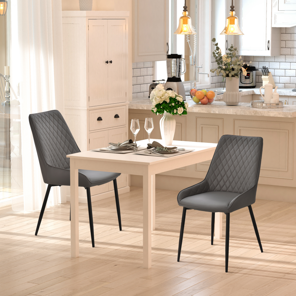 Set of 2 grey quilted PU leather dining chairs with metal frame by HOMCOM, showcasing modern design and comfort.