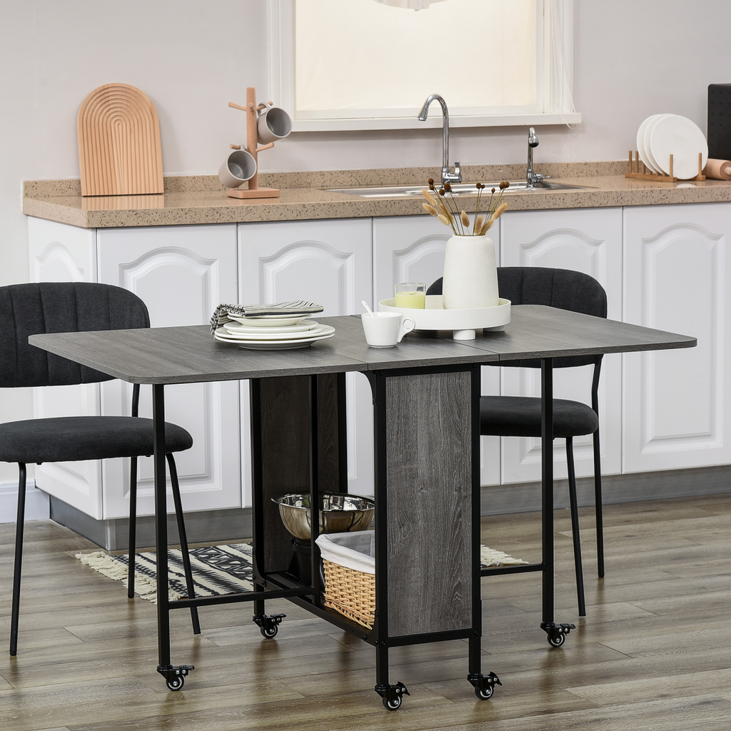 Mobile drop leaf table by HOMCOM, featuring an extendable design, seating for 6, and convenient wheels for mobility.
