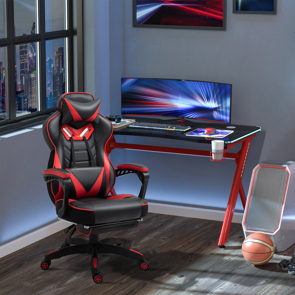 Red ergonomic gaming chair with reclining feature and manual footrest, designed for comfort in home and office settings.