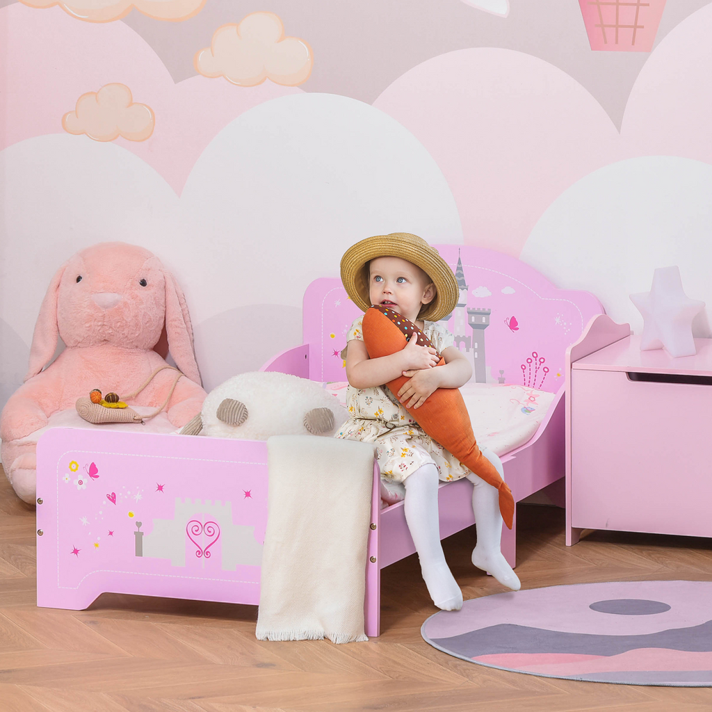 Kids pink princess castle bed with side rails and slats for ages 3-6 by HOMCOM, featuring a whimsical design.