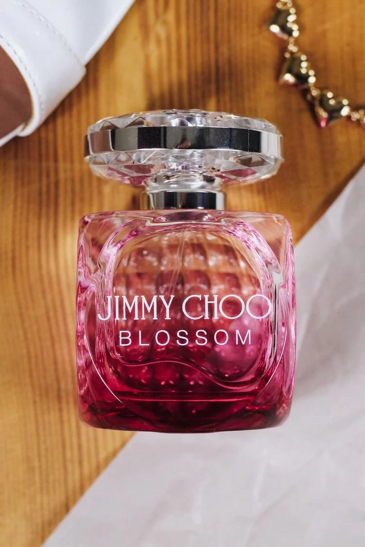 Jimmy Choo Blossom Eau de Parfum Spray 100ml bottle with floral design and pink accents on a white background.