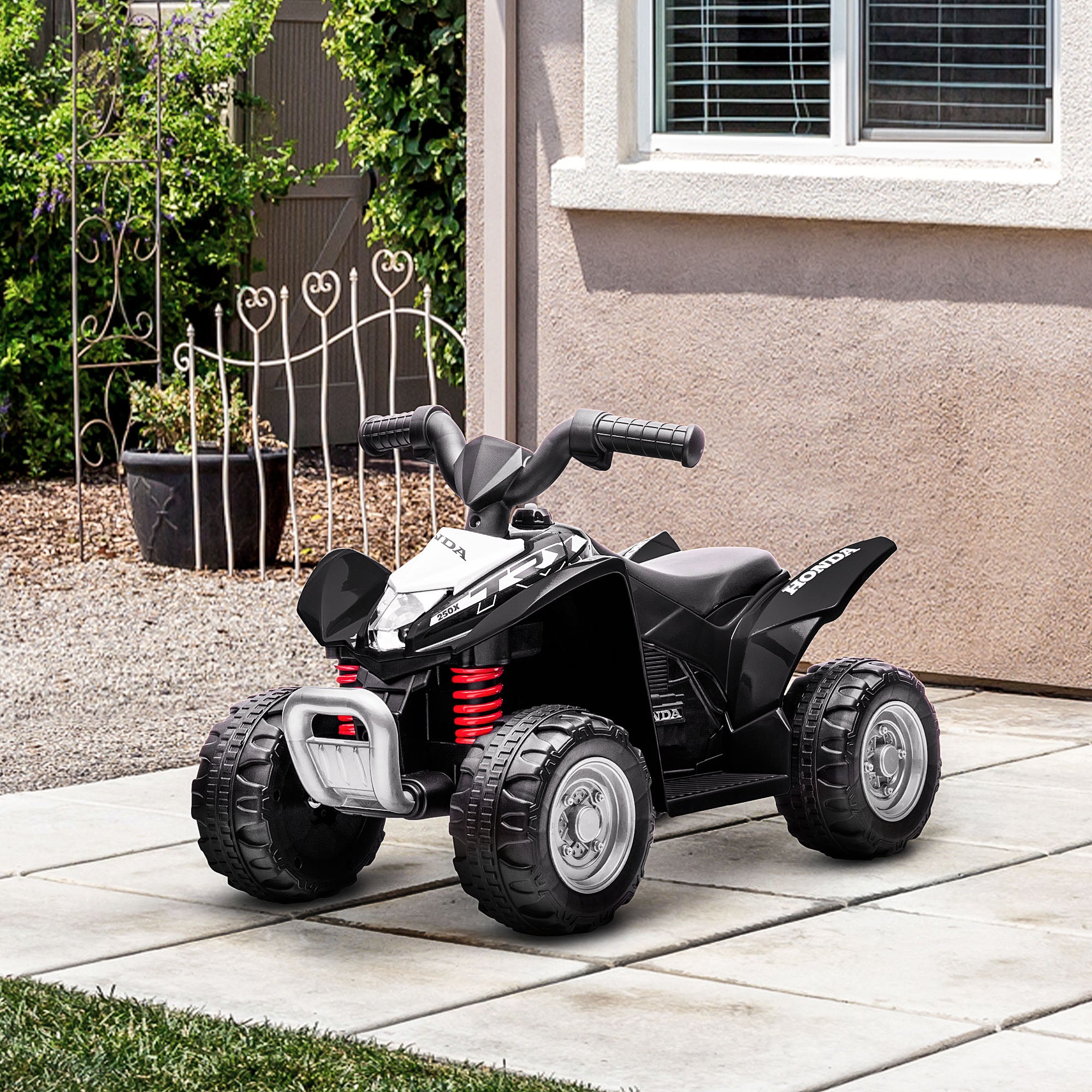Black Honda licensed kids electric quad bike by HOMCOM for ages 1.5-3 years, featuring a sturdy design and safe ride-on fun.