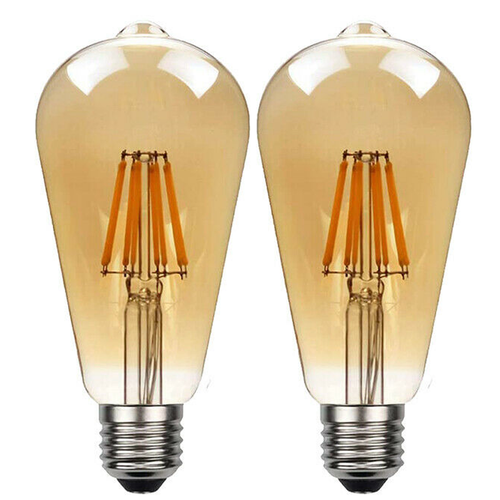 Two Ledsone vintage amber ST64 LED Edison bulbs, E27 dimmable, glowing softly at 2700K in a warm home setting.