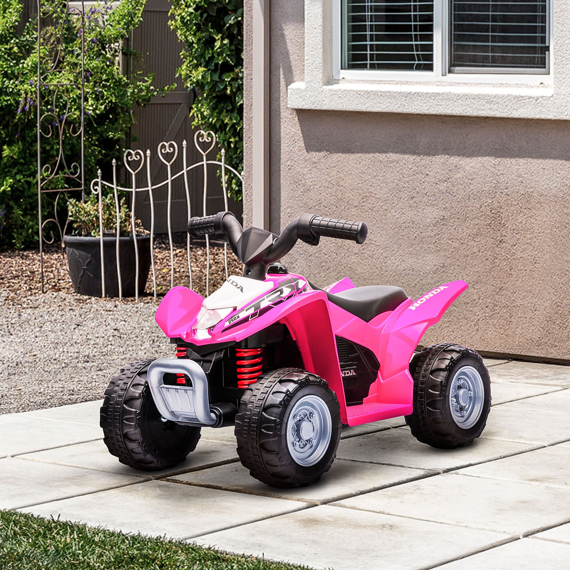 Pink Honda licensed kids electric quad bike by HOMCOM, designed for ages 1.5-3 years, featuring sturdy wheels and a fun design.