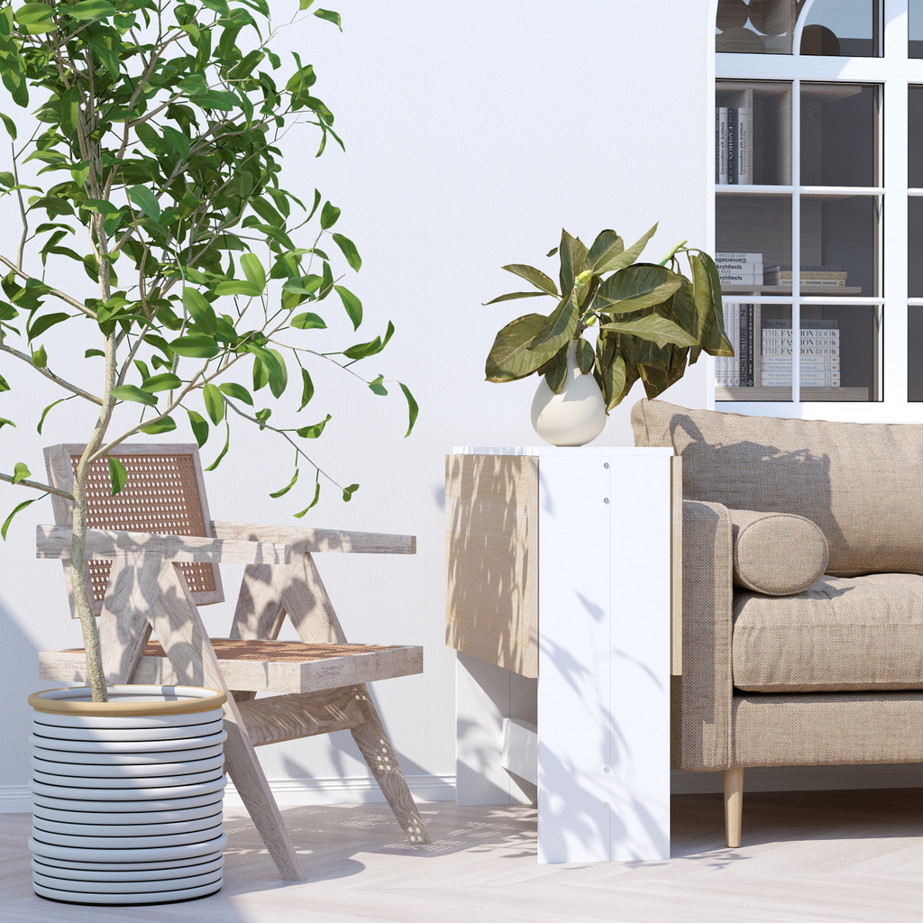 HOMCOM oak white drop leaf folding table seats 6, showcasing a space-saving, multifunctional design in a cozy setting.