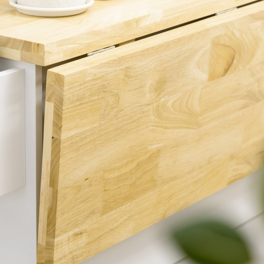 Drop-leaf kitchen island on wheels by HomeCraft, featuring storage cart with drawers and cabinet in a modern kitchen setting.