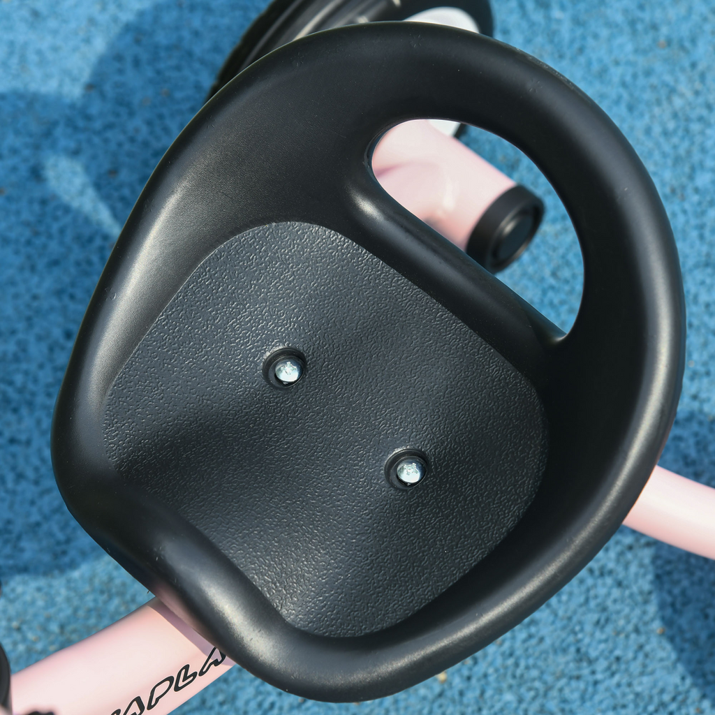 Pink AIYAPLAY kids trike with adjustable seat, basket, and bell, designed for ages 2-5 years, on a sunny playground.