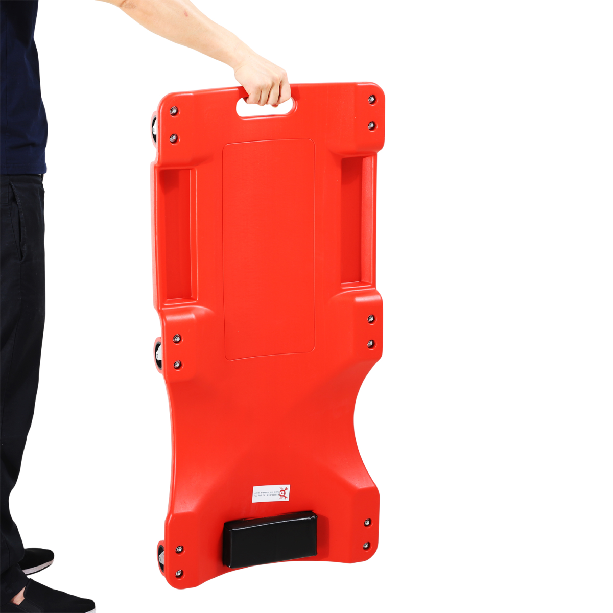 Mechanic vehicle creeper in a workshop setting, showcasing durable rolling design by AutoPro for garage assistance.