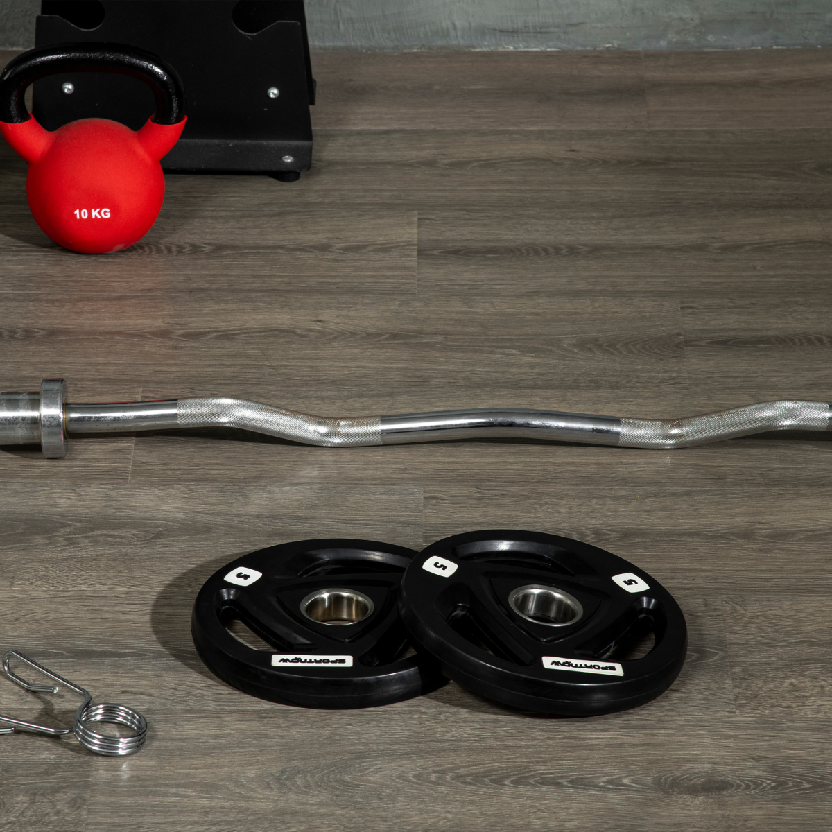 Tri-grip Olympic weight plates set with two 5kg weights and 2-inch holes for barbell use, ideal for strength training.