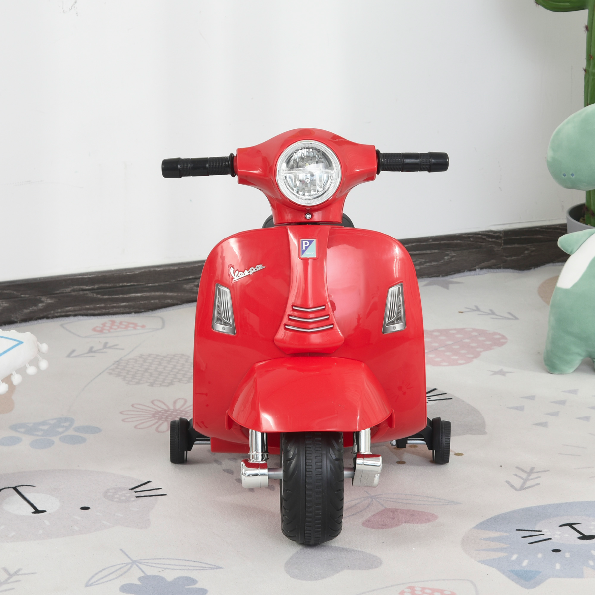 Vespa licensed kids ride-on motorcycle in red, 6V battery powered, featuring realistic design and safe riding features.