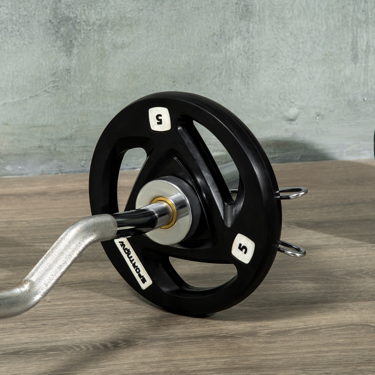 Olympic weight plates set by ActiveGear, featuring tri-grip design and 2-inch holes, includes two 5kg weights.