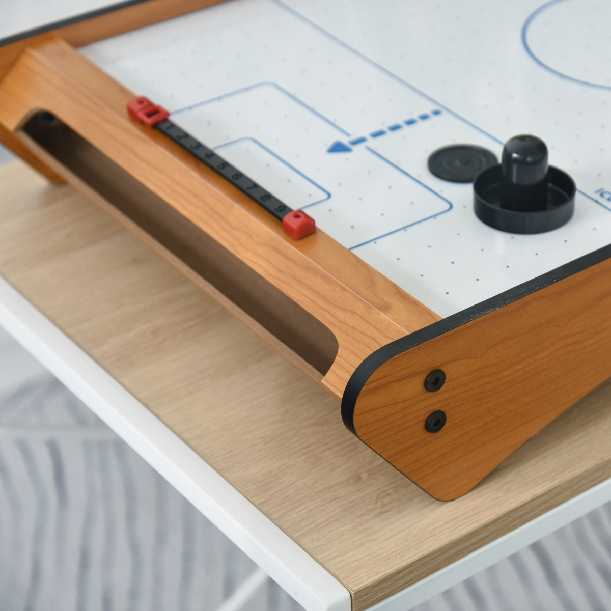 Mini Air Hockey Tabletop Game with fan motor, scoreboard, and battery operation, suitable for ages 8 and up.