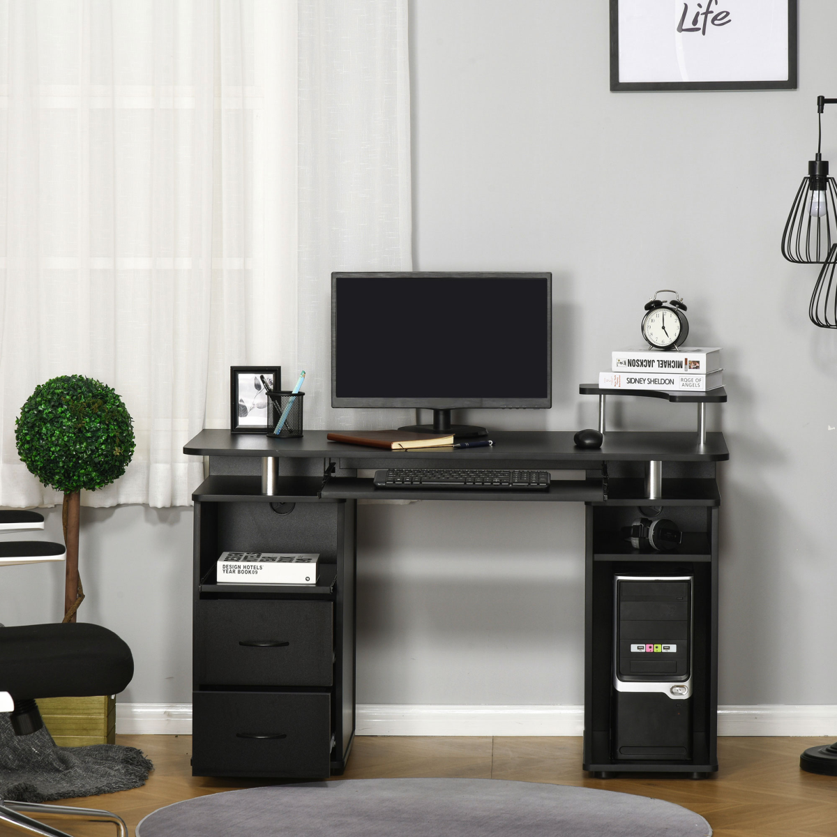 Black HomeCraft computer office desk featuring a keyboard tray, drawer, and monitor shelf.