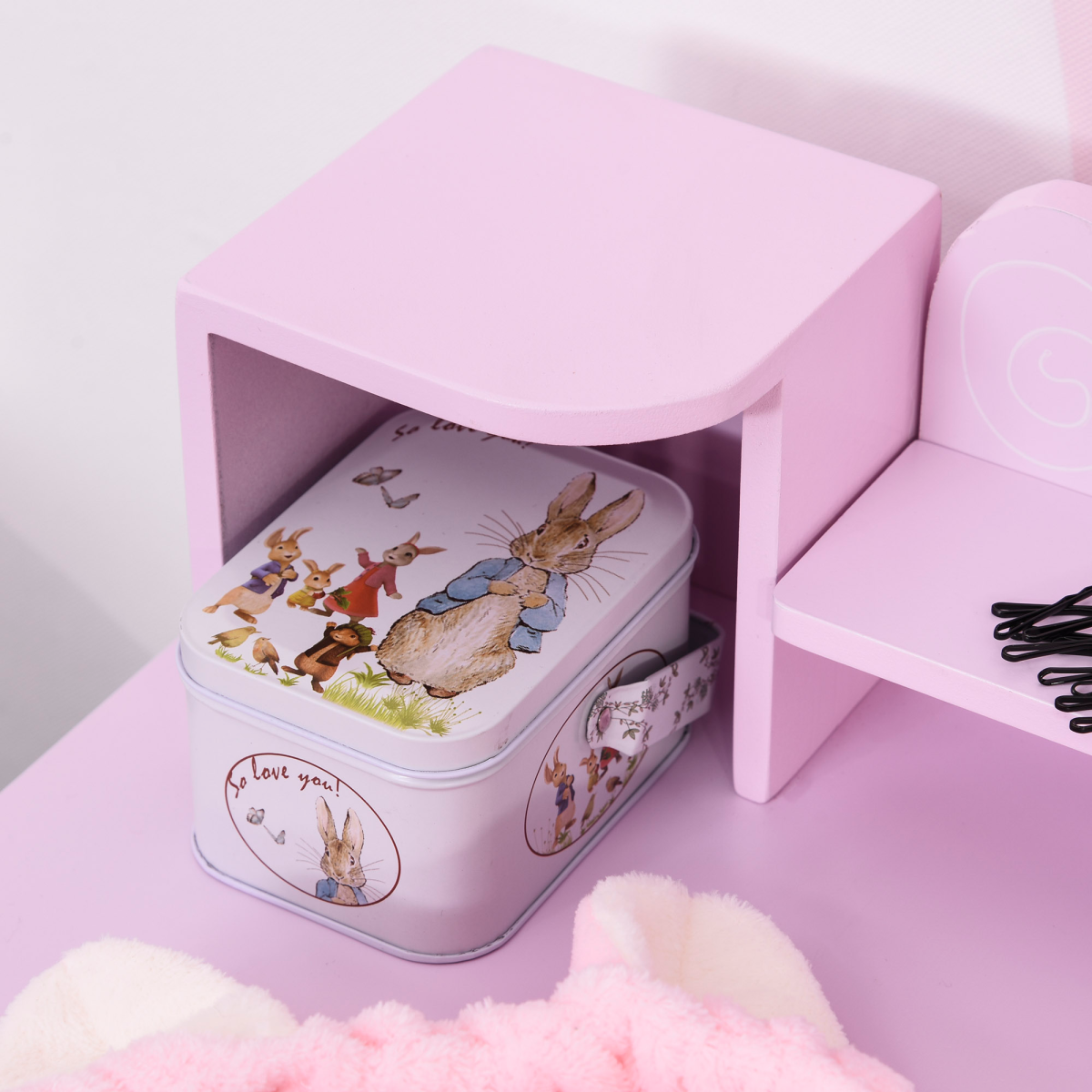 Kids dressing table and stool set in pink with cartoon patterns, featuring a mirror and storage compartments.