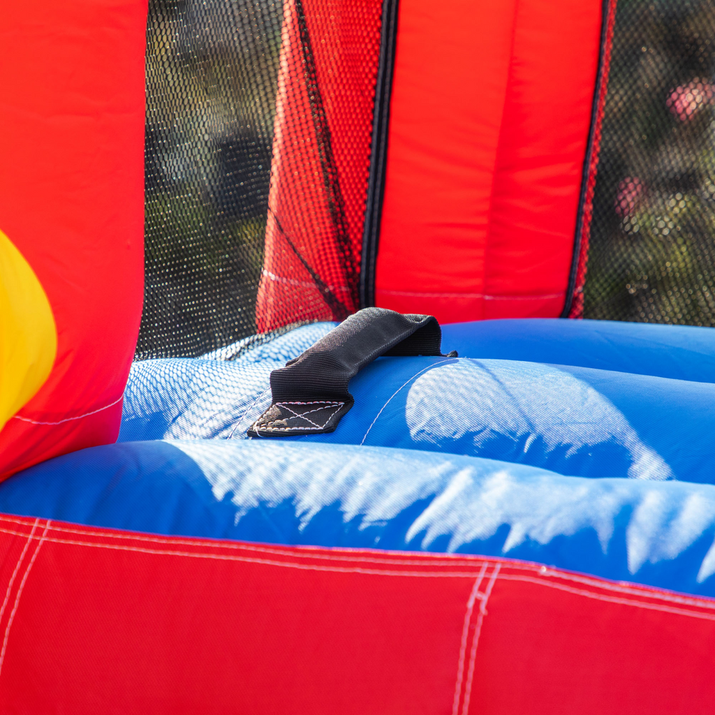 Kids bouncy castle with slide, pool, and climbing wall by FunZone, featuring vibrant colors and inflatable design.