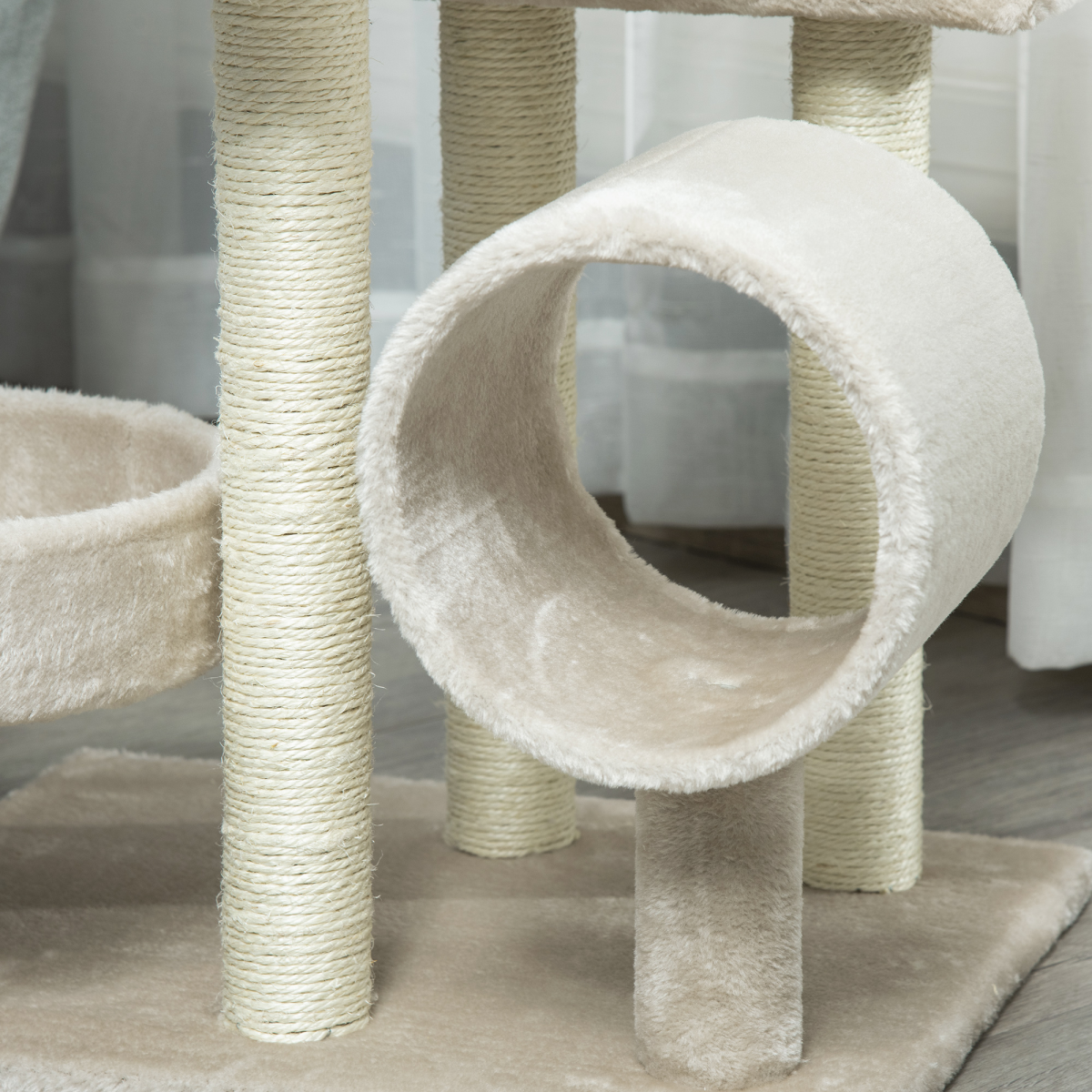 Beige Pawhut multi-level cat tree with scratching posts, perch, tunnel, and play center for cats.