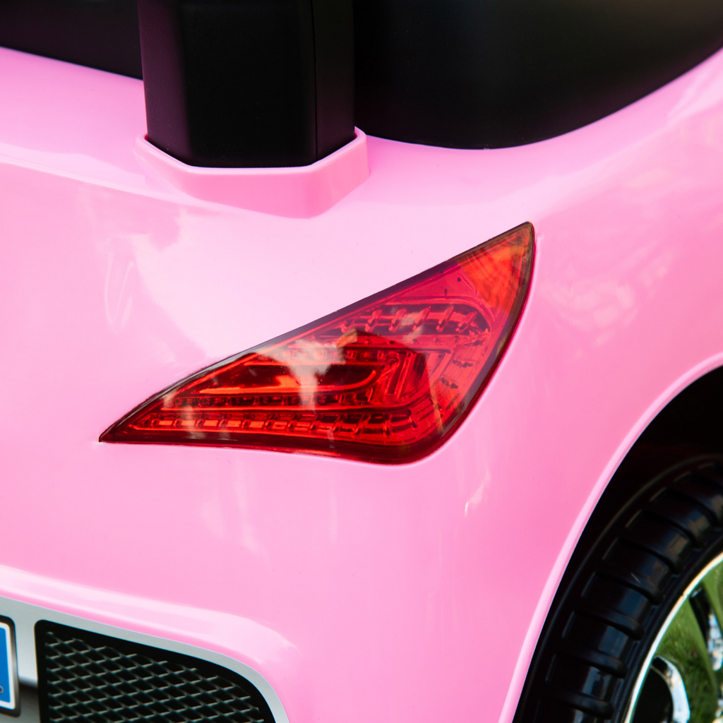 Pink HOMCOM Ride on Car for toddlers, featuring a foot-to-floor sliding design for fun and active play.