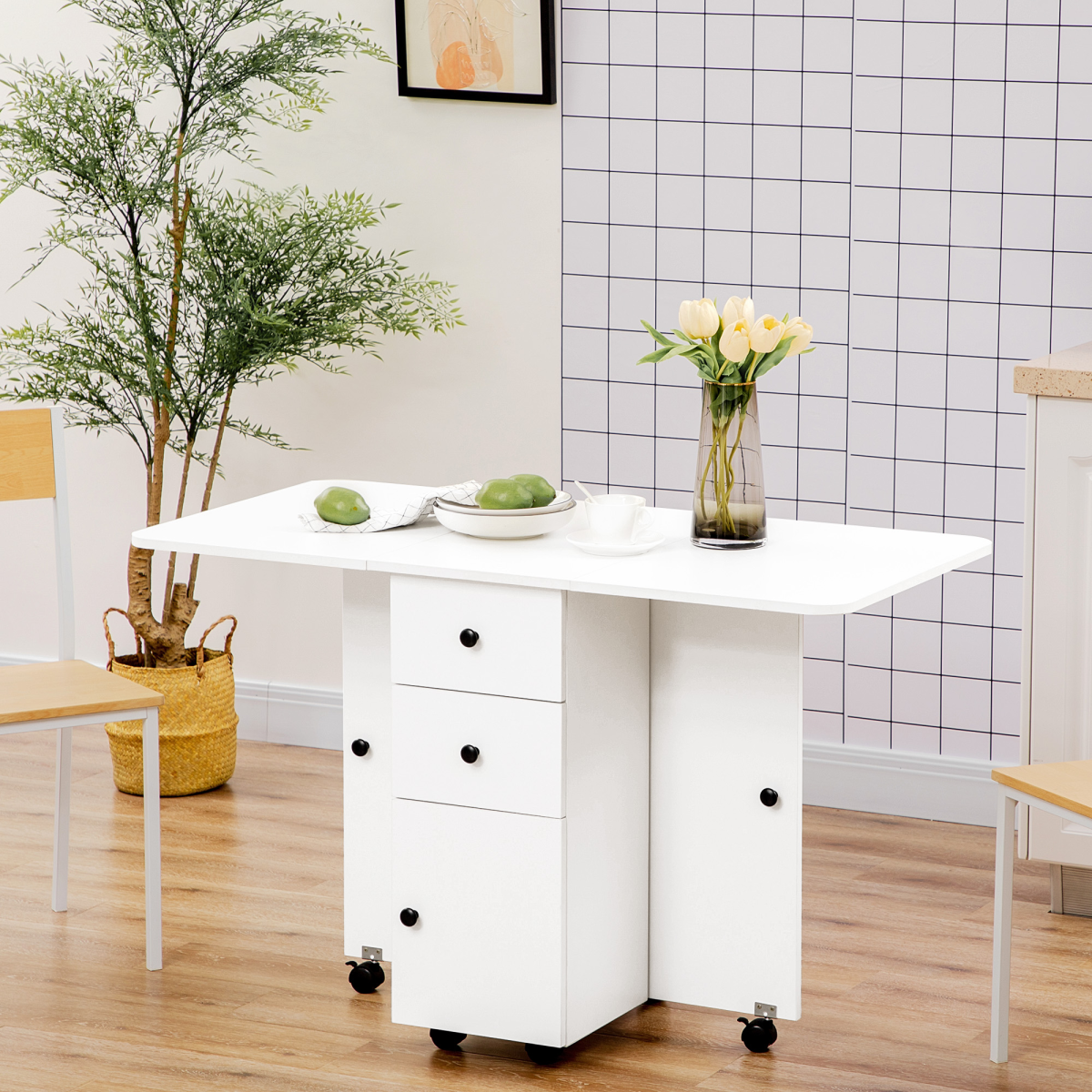 White HOMCOM folding dining table with storage drawers, drop leaf design, seats 6, displayed in a modern dining room setting.