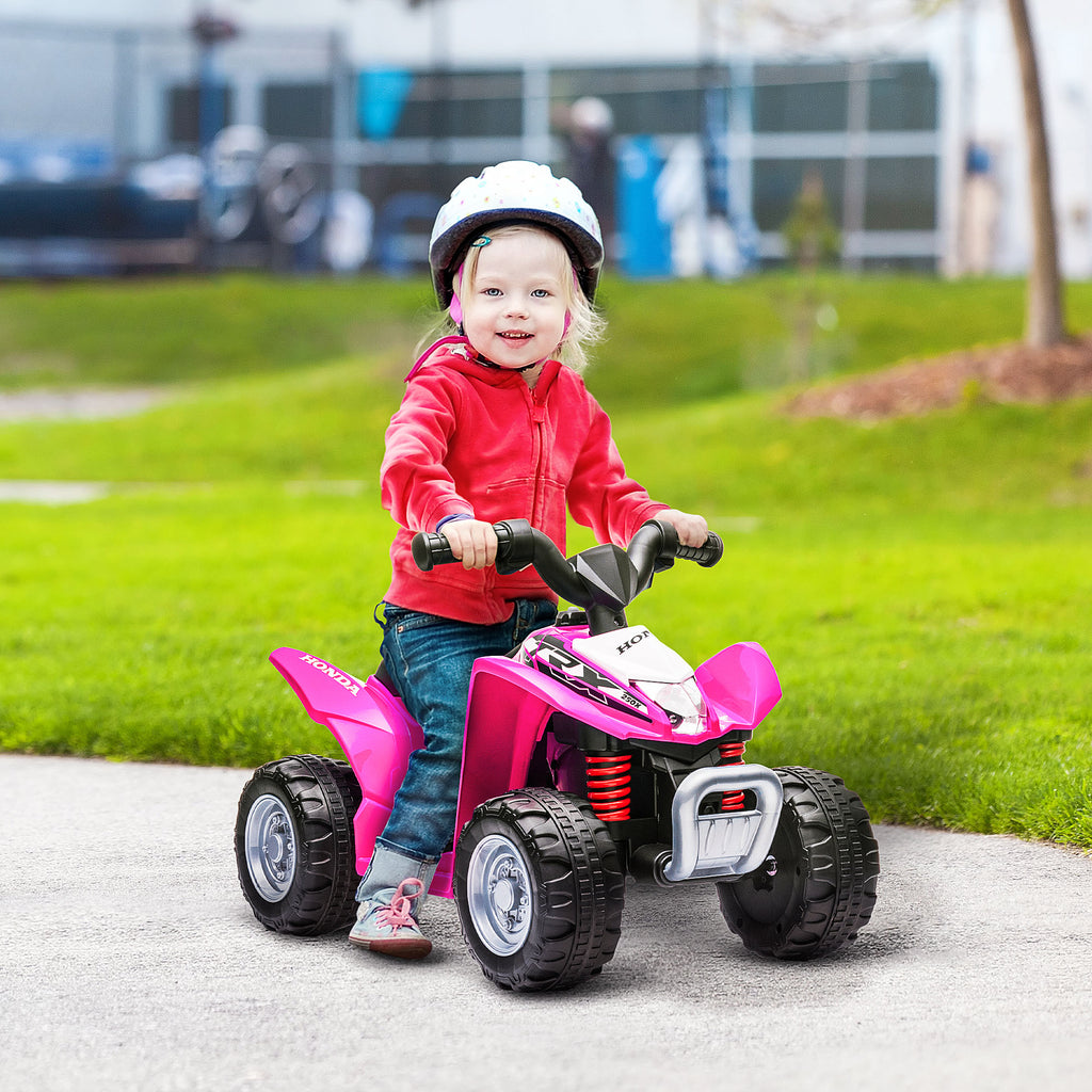 Honda licensed HOMCOM pink electric quad bike for kids aged 1.5-3 years, featuring a compact design and sturdy wheels.