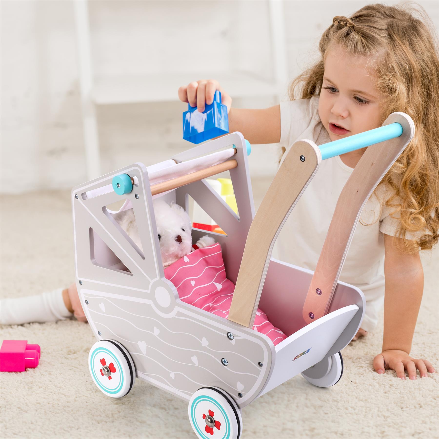 SOKA DOLLS' PRAM 0000469 in pink, designed for imaginative play with dolls from SOKA Play Imagine Learn.