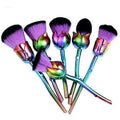 Beauty and the Beast-inspired GlowCare makeup brushes with glossy handles, featuring elegant rose designs.