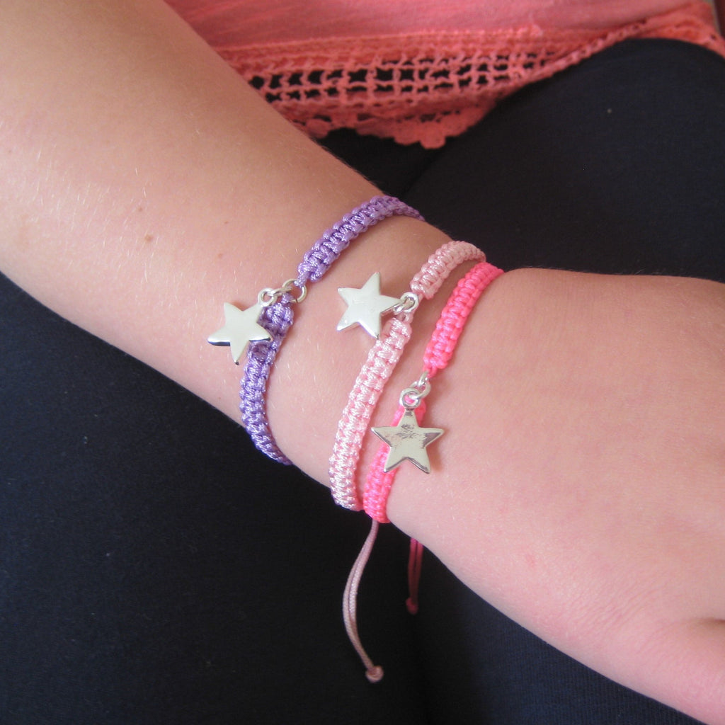 Adjustable braided cord friendship bracelet with a silver star charm by LuxeTime, showcasing intricate design and craftsmanship.