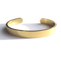 Unisex stainless steel gold bangle by LuxeTime, featured in a 14cm length, showcasing a sleek and modern design.