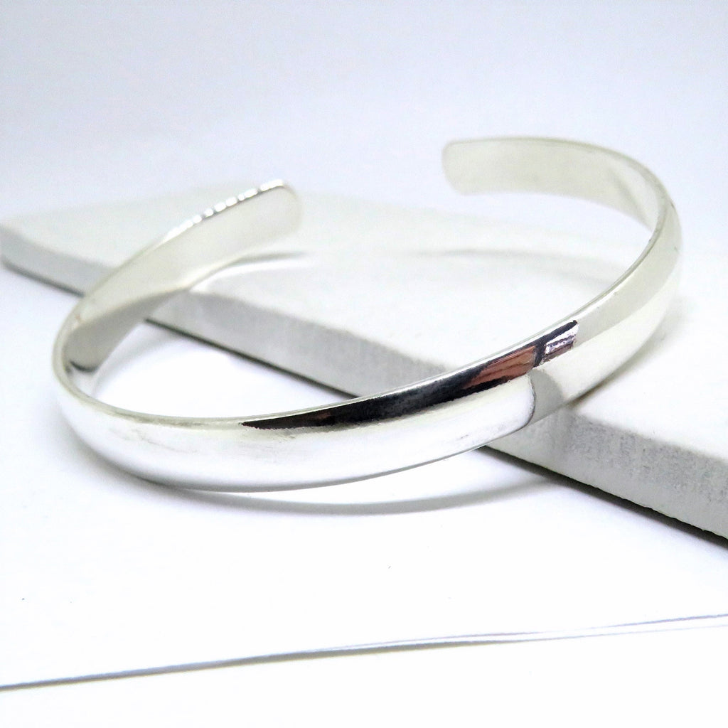 Chunky silver bangle by LuxeTime, sterling silver plated, featuring an 18cm diameter and a sleek, modern design.