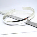 Chunky silver bangle by LuxeTime, sterling silver plated, featuring an 18cm diameter and a sleek, modern design.