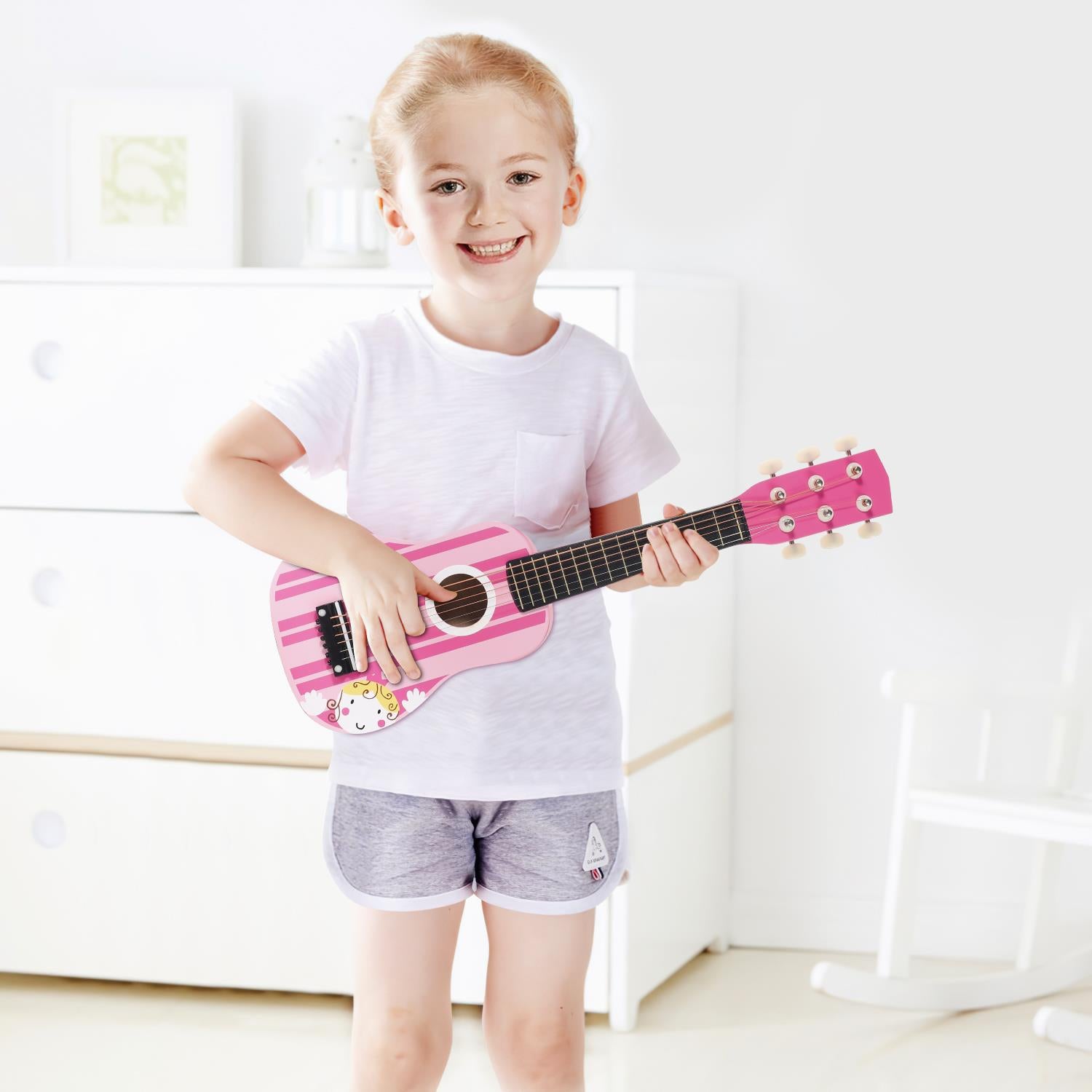 SOKA pink striped wooden guitar toy for children, promoting interactive pretend play and early musical development.