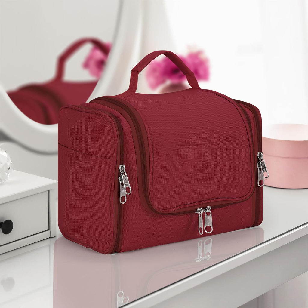 Hot pink waterproof toiletry bag by Vinsani, featuring multiple compartments for travel organization.