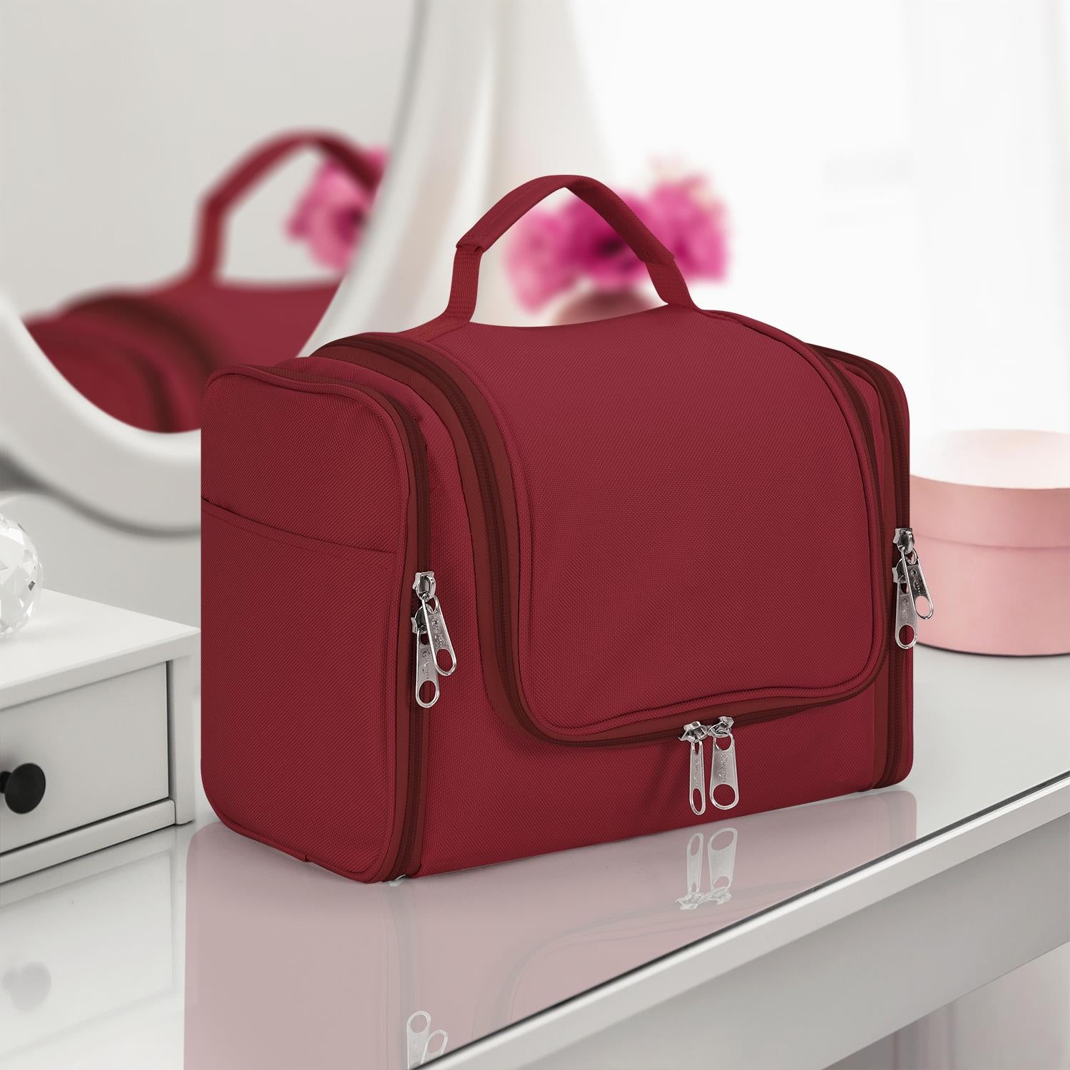 Hot pink waterproof toiletry bag by Vinsani, featuring multiple compartments for travel organization.