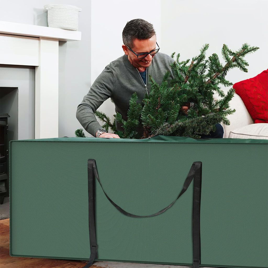 Green Deluxe Christmas Tree Storage Bag by Vinsani, designed to protect artificial trees, shown with sturdy handles.