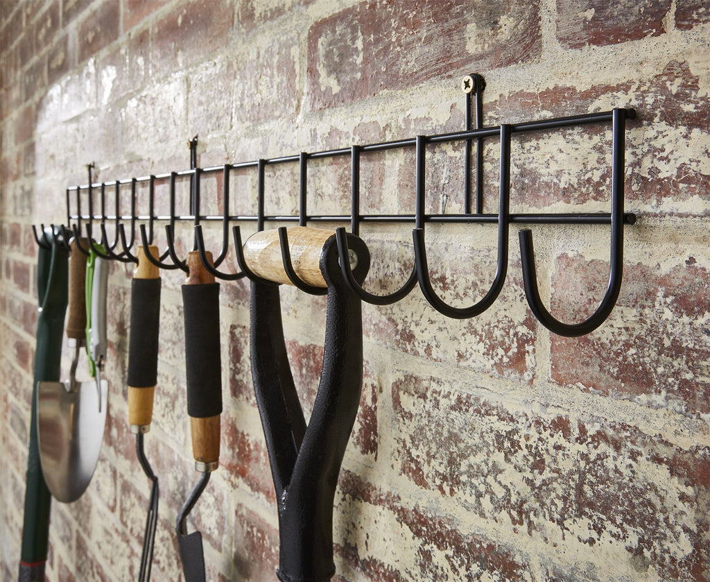 Extra-long black tool rack with 16 hooks, measuring 102cm, ideal for organizing tools in a garage or workshop.