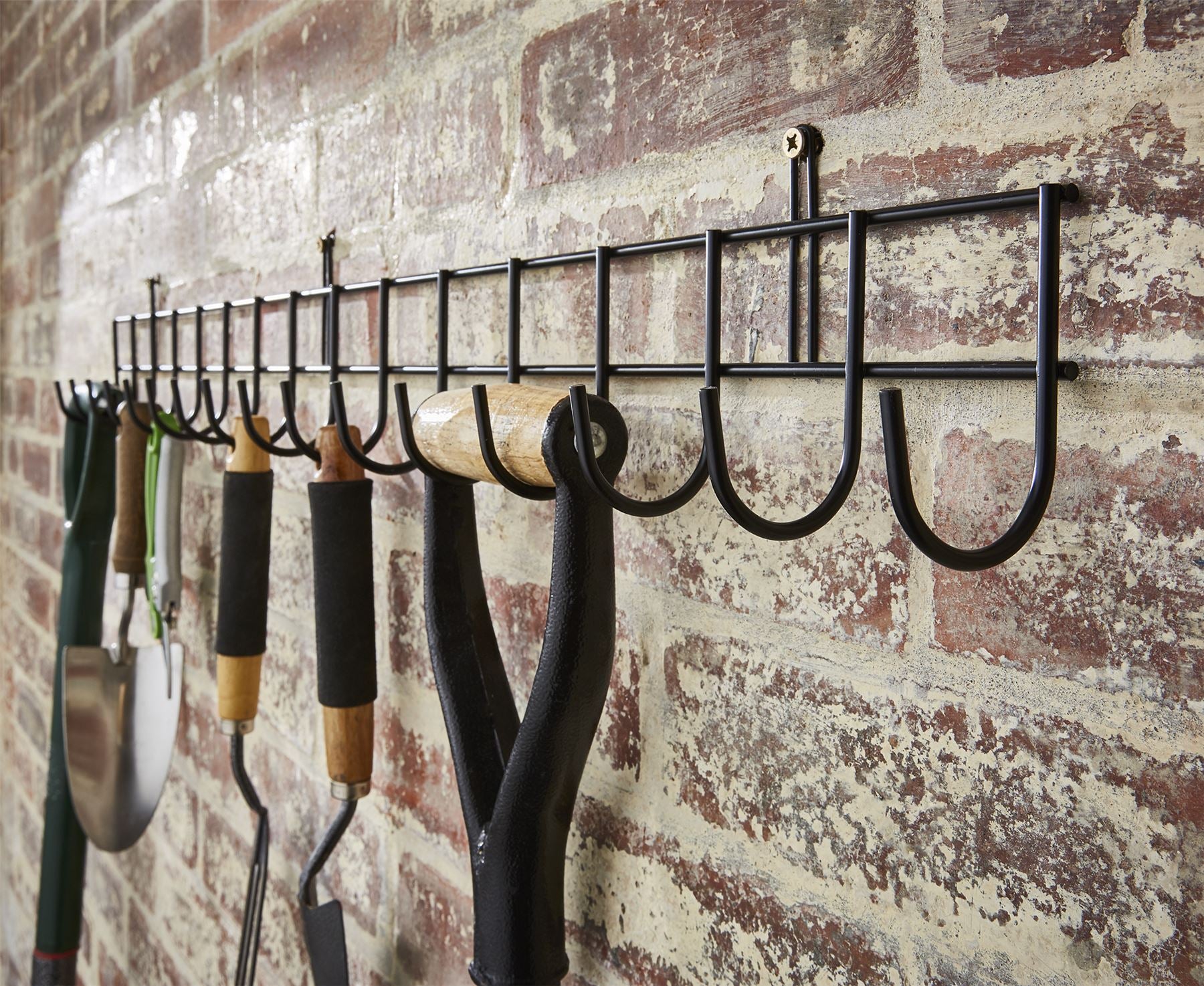 Extra-long black tool rack with 16 hooks, measuring 102cm, ideal for organizing tools in a garage or workshop.