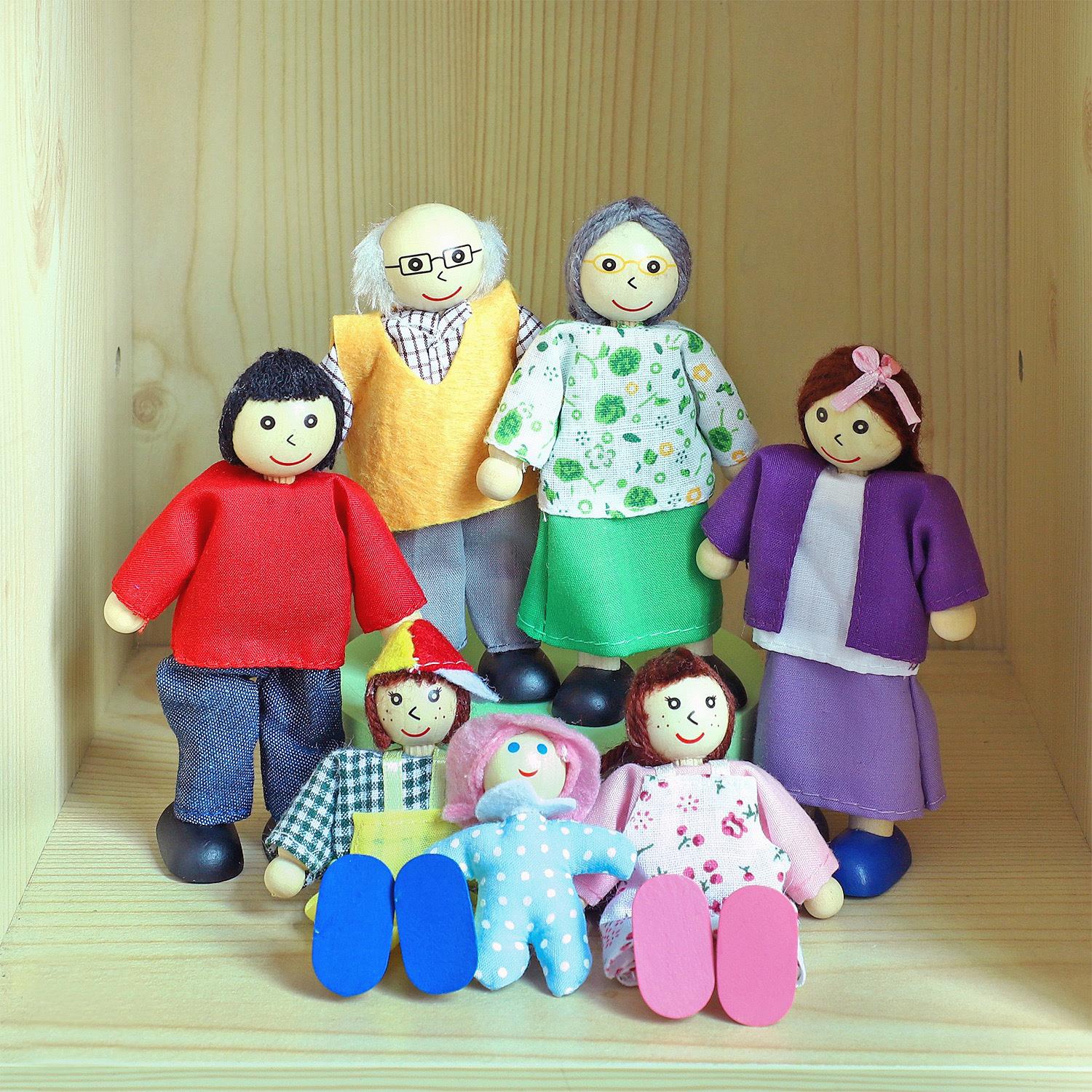 Wooden Happy Family Doll Set by SOKA Play Imagine Learn with 7 flexible-arm figures in colorful outfits.