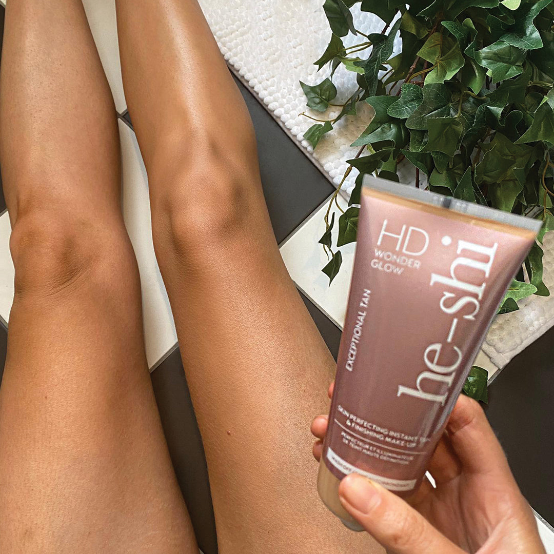 He-Shi HD Wonder Glow body makeup tube with a smooth consistency, displaying its wash-off glow for radiant skin.